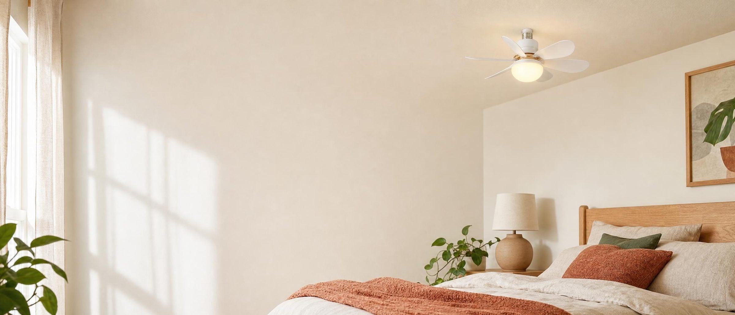 Sunlit rental bedroom with a socket fan light installed on the ceiling